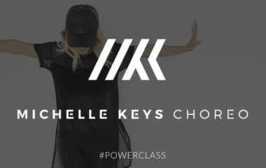 A woman in black shirt and hat with words " michelle keys chops # powerclass ".