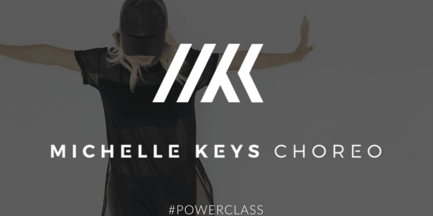 A woman in black shirt and hat with words " michelle keys chops # powerclass ".